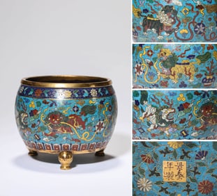 A CLOISONNé ENAMEL 'LION AND BALL' TRIPOD CENSER