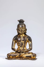 A GILT-BRONZE BUDDHIST FIGURE