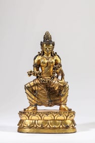 A GILT-BRONZE BUDDHIST FIGURE