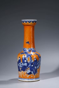 AN IRON-RED GROUND BLUE AND WHITE 'FIGURE SCENE' VASE