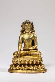 A GILT-BRONZE BUDDHIST FIGURE