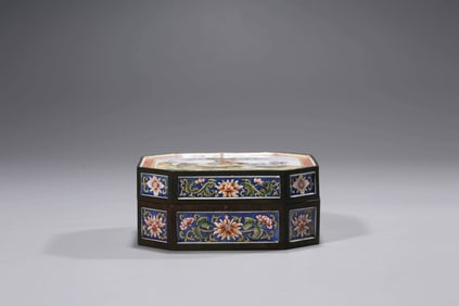 A PAINTED ENAMEL COVERED BOX