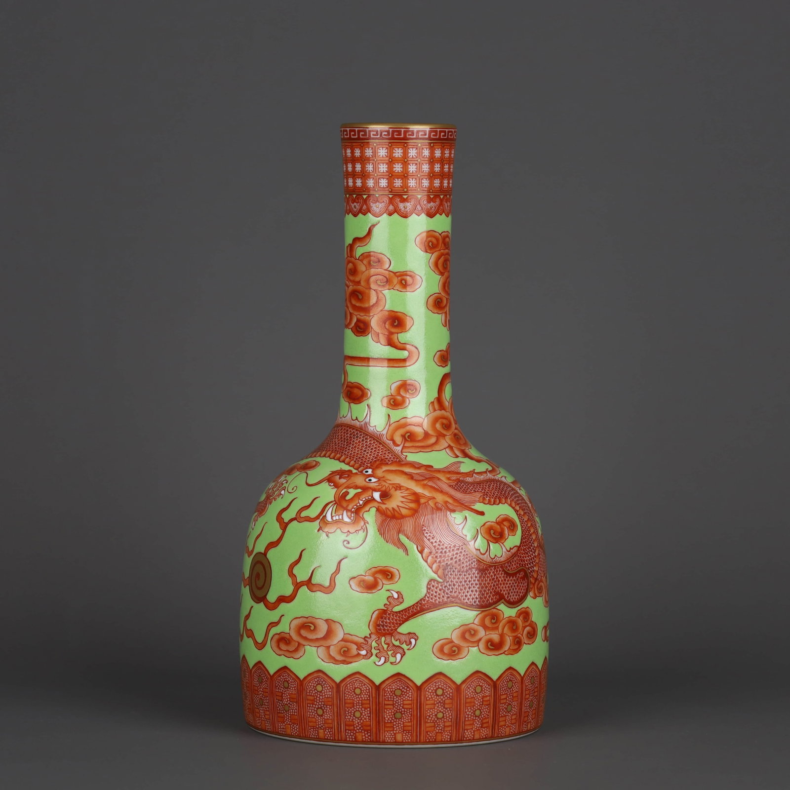 A GREEN-GROUND WITH IRON-RED AND GILT-DECORATED 'CLOUDS AND DRAGONS' BELL-SHAPED VASE: A GREEN-GROUND WITH IRON-RED AND GILT-DECORATED 'CLOUDS AND DRAGONS' BELL-SHAPED VASE Dimensions: Height: 21.5 cm (8.5 in.), Belly Diameter: 11.2 cm (4.4 in.). All measurements are approximate. Any co