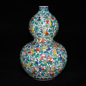 A DOUCAI 'BAT AND DEER' GOURD-SHAPED VASE