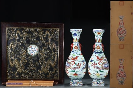 A PAIR OF BLUE AND WHITE WITH WUCAI 'CLOUD DRAGONS' BEAST-EAR VASE