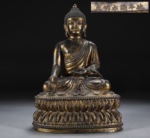A SEATED BHAISAJYAGURU STATUE