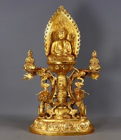 A GILT BRONZE HAND-CHISELED BUDDHA STATUE