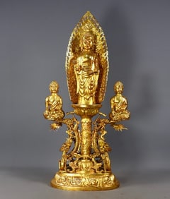 A GILT HAND-CHISELED BUDDHA STATUE