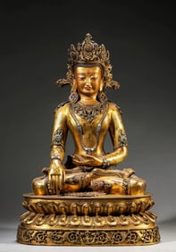 A GILT-BRONZE AND GEM-SET AMITAYUS BUDDHA