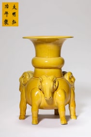 A YELLOW-GLAZED SIX-LEGGED JAR