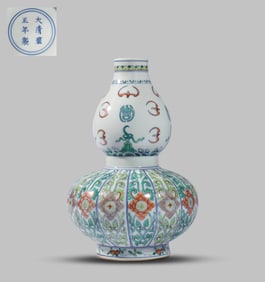 A DOUCAI 'AUSPICIOUS BEASTS AND FLOWERS'  VASE