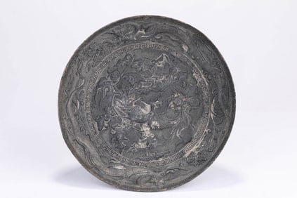 A SILVER 'DRAGON AND PHOENIX' DISH
