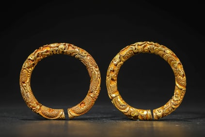A PAIR OF GILT-BRONZE BRACELETS