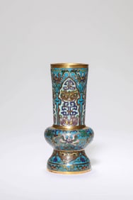 A CLOISONNé ENAMEL 'INTERLOCKING FLOWERS AND TAOTIE' BEAKER VASE