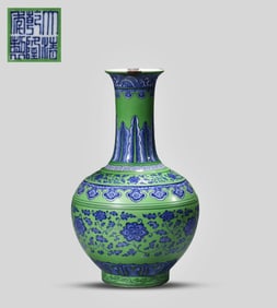 A GREEN-GROUND BLUE AND WHITE VASE