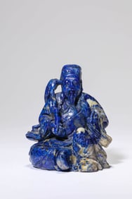 A LAPIS LAZULI CARVED FIGURE