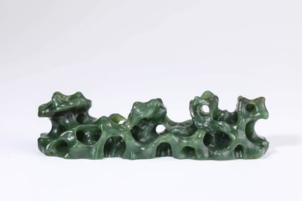 A SPINACH-JADE BRUSH REST