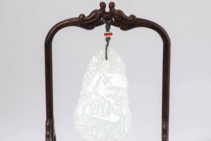 A JADE CARVED 'SCHOLARS UNDER PINE TREE WITH POEM' GOURD PLAQUE