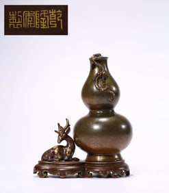 A BRONZE-GLAZED DOUBLE-GOURD VASE