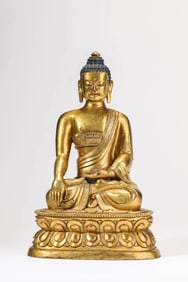 A GILT-BRONZE SHAKYAMUNI