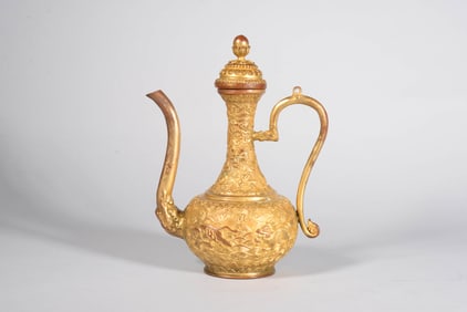 A GILT-BRONZE 'DRAGON IN WAVES' EWER