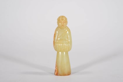A YELLOW JADE FIGURE