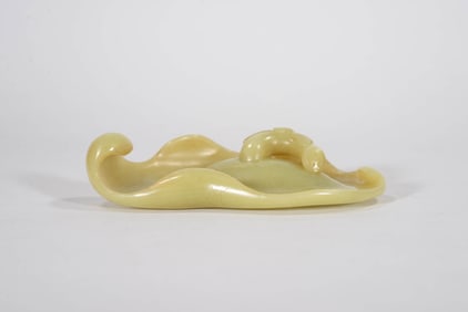 A YELLOW JADE 'LOTUS LEAF' WASHER