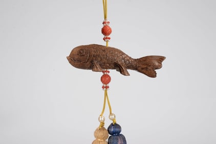 AN ALOESWOOD FISH PENDANT