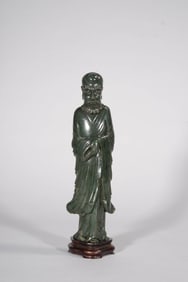 A SPINACH JADE BODHIDHARMA FIGURE