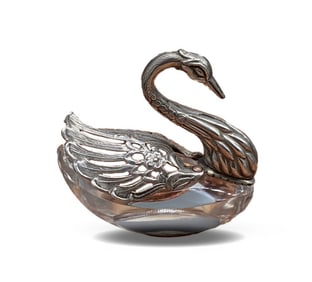 A SMALL CRYSTAL GLASS JAR IN THE SHAPE OF A SILVER SWAN