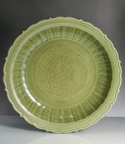 A LONGQUAN CELADON INCISED 'FRUIT AND FLOWER' DISH