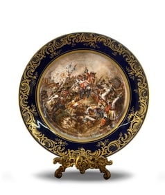 A HAND-PAINTED PORCELAIN PLATE BY THE FRENCH ARTIST GEOFFEOY, TITLED "BATTLE OF DENAIN"