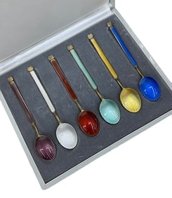 A SET OF SILVER-GILT ENAMEL SPOONS