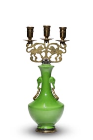 A GREEN-GLAZED CANDLESTICK
