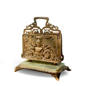 A COPPER-GILT OPENWORK RELIEF LETTER RACK