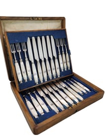 A SET OF MOTHER-OF-PEARL AND SILVER-PLATED CUTLERY