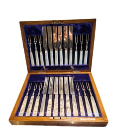 A SET OF SILVER-PLATED MOTHER-OF-PEARL KNIFE AND FORK
