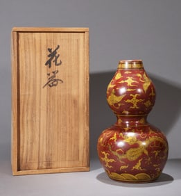 A RED GLAZED 'CLOUD, DRAGON AND CRANE' GOURD-SHAPED VASE