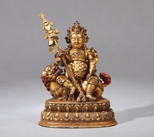 A GILDED COPPER VAISHRAVANA FIGURE