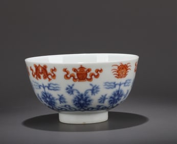 A BLUE AND WHITE WITH IRON-RED 'LOTUS AND BABAO' BOWL