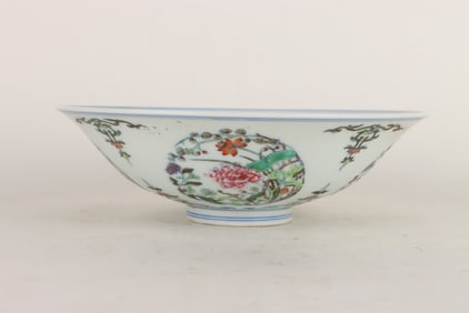 A DOUCAI 'ROUNDEL FLOWERS' CONICAL BOWL