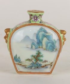 A FAMILLE ROSE GREEN-GROUND 'LANDSCAPE' SNUFF BOTTLE