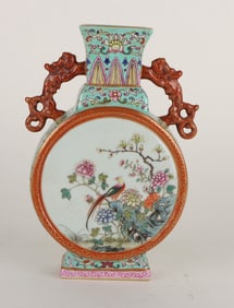 A GREEN-GROUND FAMILLE ROSE MEDALLION 'FLOWERS AND BIRDS' SMALL MOONFLASK