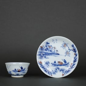 A BLUE AND WHITE WITH COPPER-RED 'LANDSCAPE AND FIGURES' CUP