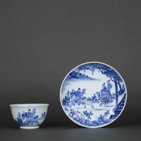 A BLUE AND WHITE 'FIGURES' CUP