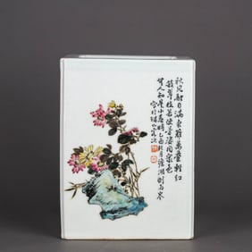 A FAMILLE ROSE 'PLUM, ORCHID, BAMBOO AND CHRYSANTHEMUM' BRUSH POT