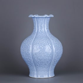 A BLUE GLAZED CARVED 'INTERLOCKING FLOWERS' VASE