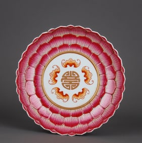 A CARVED FAMILLE ROSE WITH IRON-RED AND GILT-DECORATED 'BATS AND SHOU' DISH