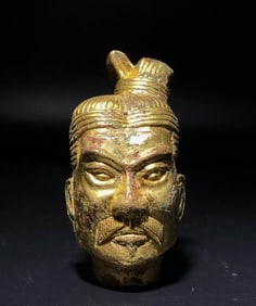 A GILDED BRONZE FIGURINE HEAD