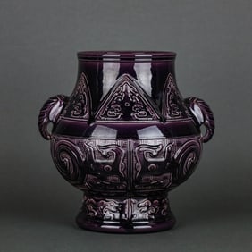 A PURPLE GLAZED CARVED 'TAOTIE' VASE